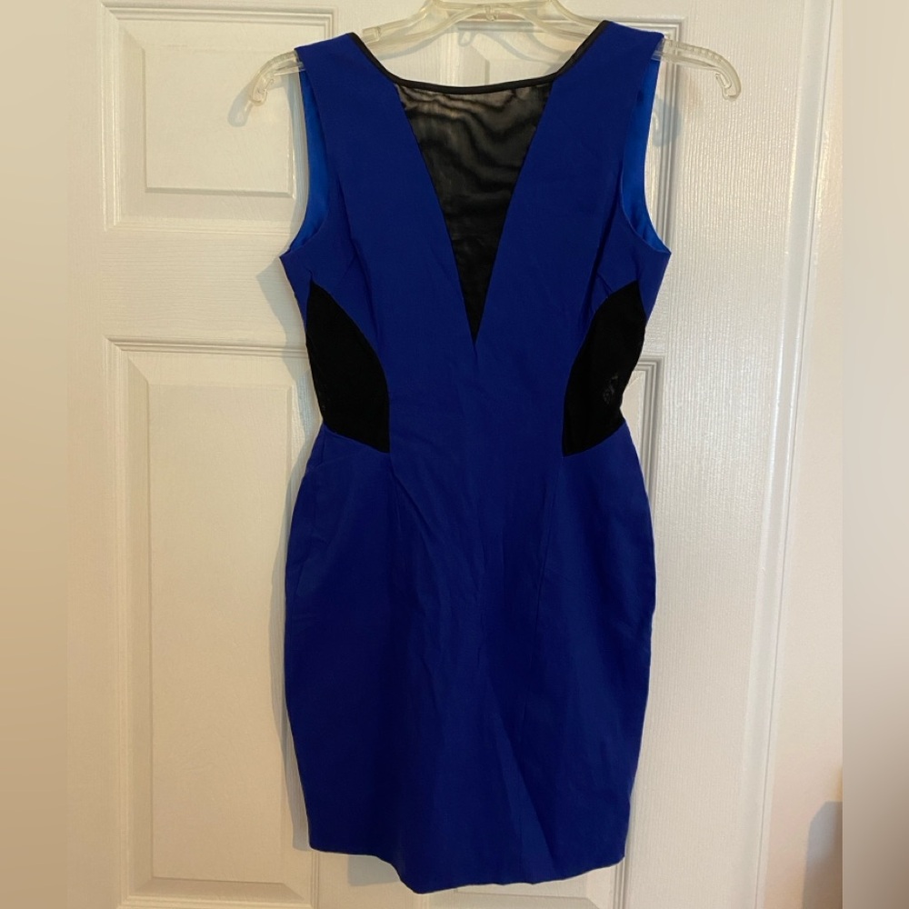 Make a Statement in this Bright Blue Mini Dress with Sheer Black Cutouts